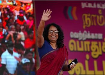Sri Lanka's Prime Minister Harini Amarasuriya waves to her party National People's Power (NPP) supporters.