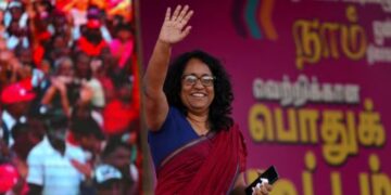Sri Lanka's Prime Minister Harini Amarasuriya waves to her party National People's Power (NPP) supporters.