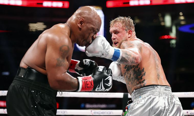 Jake Paul lands a punch on Mike Tyson during their fight at AT&T Stadium in Arlington, Texas.