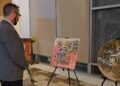 The exhibition featured the renowned calligrapher Ayesha Kamal and was attended by a diverse group of individuals.