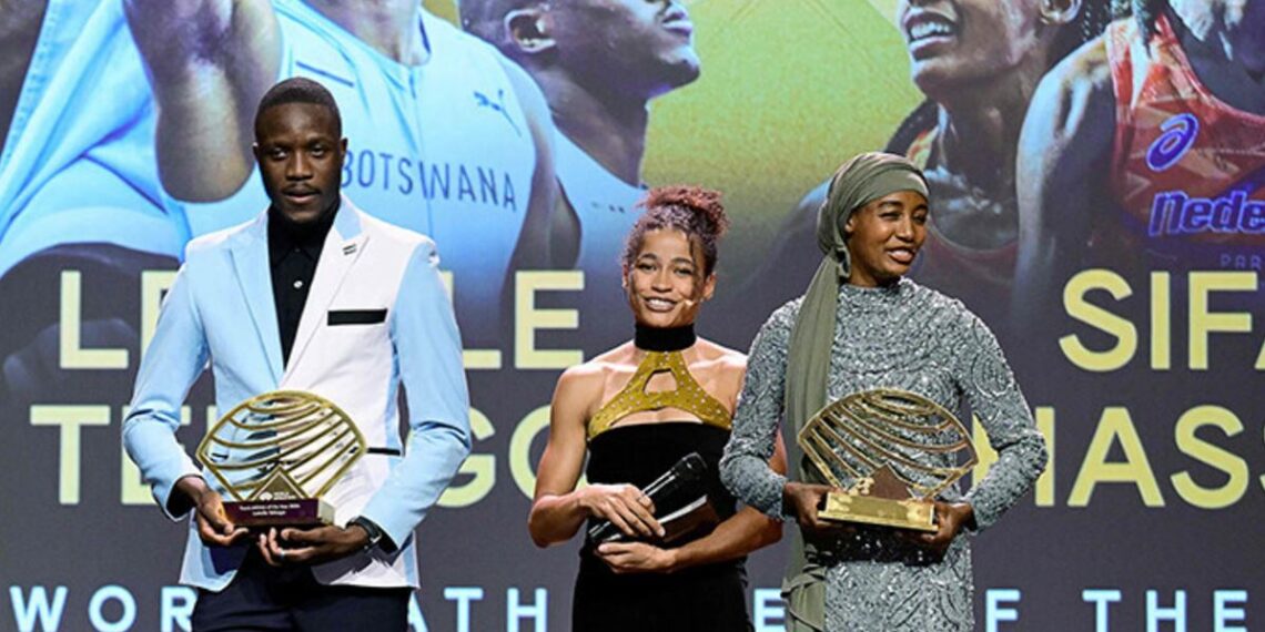 Botswanan sprinter Letsile Tebogo (L) holding his the Men’s Track Athlete of the Year Award and Dutch middle and long-distance runner Sifan Hassan (R) holding her the Women’s Out of Stadium Athlete of the Year Award.