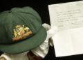 A cap worn by Australia's greatest batsman Don Bradman will be auctioned in Sydney on Tuesday.