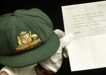 A cap worn by Australia's greatest batsman Don Bradman will be auctioned in Sydney on Tuesday.