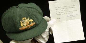 A cap worn by Australia's greatest batsman Don Bradman will be auctioned in Sydney on Tuesday.