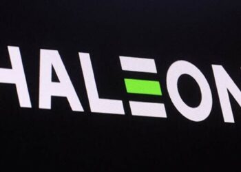 The company logo for Haleon and the trading info is displayed on a screen.