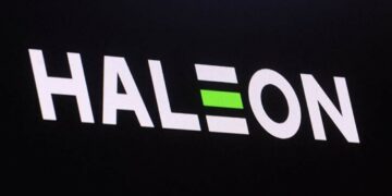 The company logo for Haleon and the trading info is displayed on a screen.
