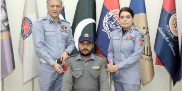 IG Punjab Dr. Usman Anwar (L) and CTO Lahore Ammara Athar (R) pin badge of Chief Traffic Officer Lahore to DIG Athar Waheed (C) in Lahore.