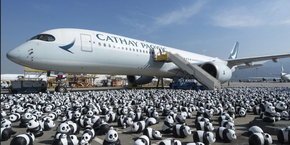Some of the 2,500 panda sculptures are displayed at the Hong Kong International Airport .