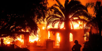 Thousands evacuate as wildfires rage in Hollywood Hills.
